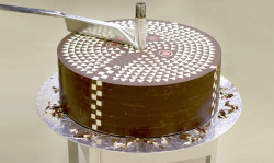 itscolossal:  Hidden Geometric Patterns Gradually Revealed inside Giant Chocolate Cylinder