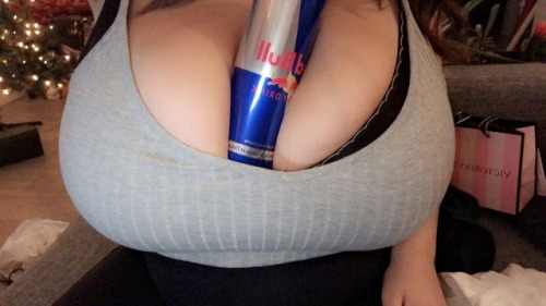 sexygirlzeverywhere: 473ml Red Bull can between my huge tits [OC] The new red bull flavor was a hit 