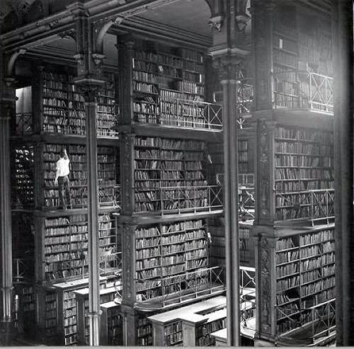 kimmisniceandnaughty:  A man browsing for books in Cincinnati’s cavernous old main library. 