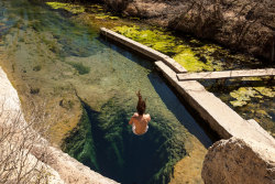 lonelycoast:  Jacob’s Well in my home town Wimberley TX, right outside of Austin. As a kid I lived less than half a mile from it and spent summer days here. No telling how many times I’ve leapt from that rock. 