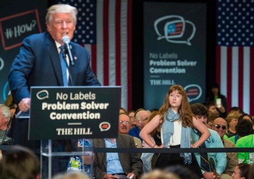 owlmylove:  verticalbutthole:  Lauren Batchelder of Chester N.H. waits for Donald Trump to stop talking after interrupting her and to continue with her question on women’s rights at the No Labels Problem Solver Convention in Manchester N.H. on Monday,
