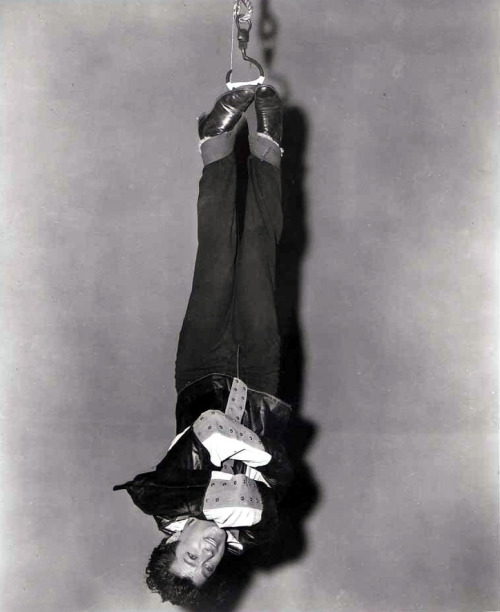 Tony Curtis suspended from ropes as Houdini, 1953