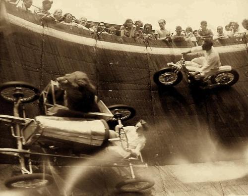 historicaltimes:  Unidentified lion and female Wall of Death driver , Revere Beach in 1929 via reddit