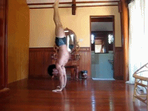GIF of a man doing a handstand.