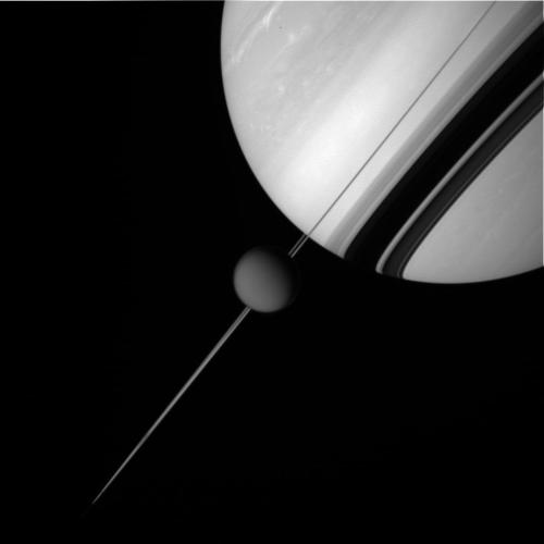 spaceexp:A picture of Saturn and Titan shot by the Cassini spacecraft from a distance of 470,816 mil