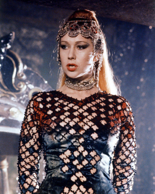 costumeloverz71: Morgana (Helen Mirren) Red cutout dress… Excalibur (1981).. Costume by Bob Ringwood