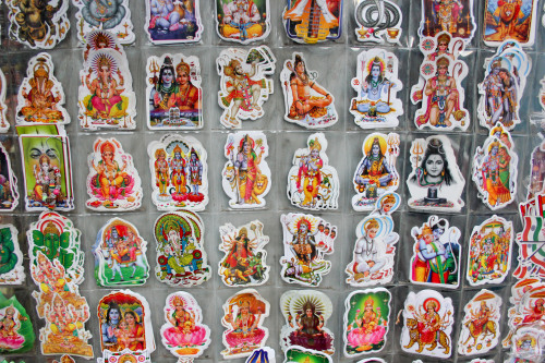 One religion, many gods. // Street shopping in India.