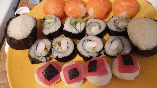 Old bento and sushi. Much approved on the rolls.Top: salmon nigiri,tuna nigiri,California rolls,