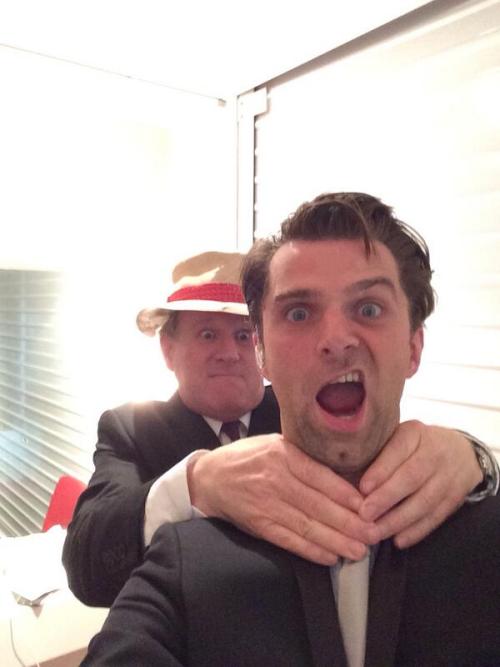 blueboxbelle:  Peter Davison photobombing conductor Ben Foster like a pro at the Doctor Who Symphoni
