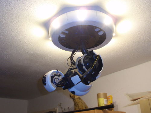 insanelygaming:  3D GlaDOS Robotic Ceiling Arm Lap Created by dragonator Check out Instructables for full instructions on how to make your own lamp! 