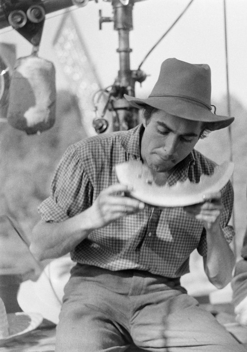 Tyrone Power eating a watermelon on the set of Jesse James, 1939