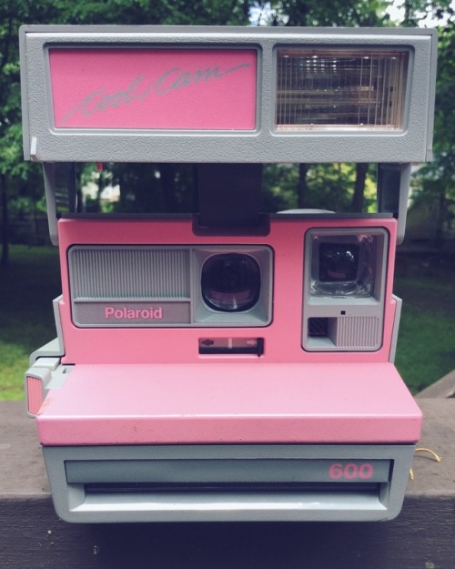 Characterized by a retro boxy profile and chic color combination, the pink and gray Polaroid 600 Coo