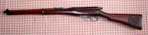 A Boer War Lee Enfield Cavalry carbine with unit emblem carved in stock.  Owned by a user on british