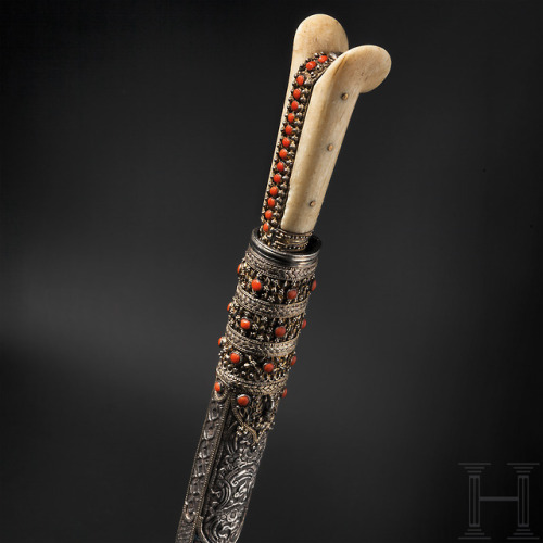 Turkish dagger with bone hilt, mounted with silver and red coral, circa 1800.from Hermann Historica