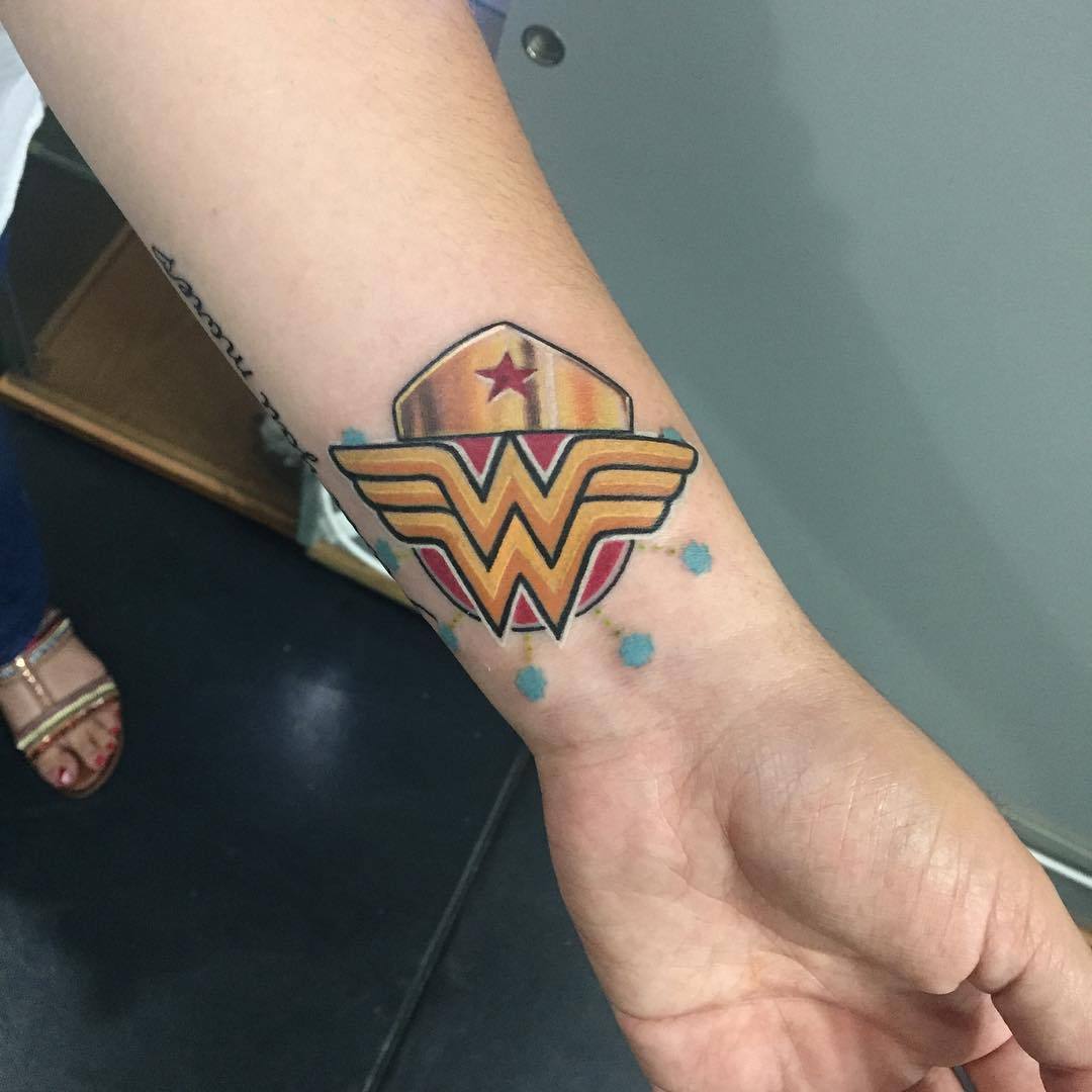LAC - Est 2009 — made this custom Wonder woman emblem tattoo. Based...