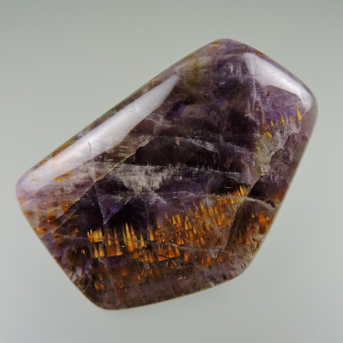 ggeology:    (Super Seven Quartz) Amethyst with Cacoxenite and Goethite inclusions // Brazil  