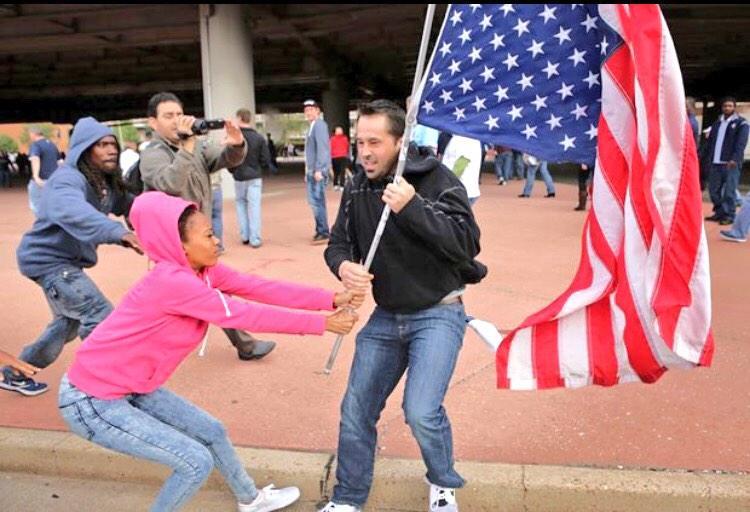 land-of-propaganda:  FERGUSON OCTOBER  Black female citizen intervenes in strong-arm