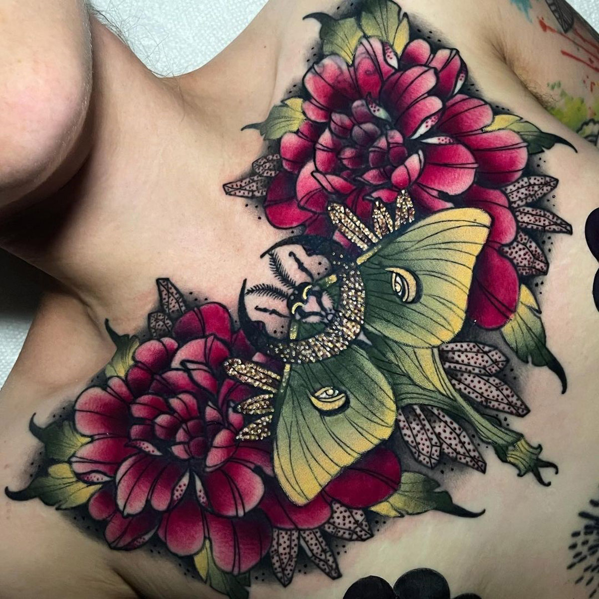 small moth chest tattooTikTok Search