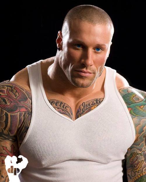 An exceptionally handsome looking man - muscles, ink, blue eyes - Perfect