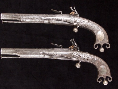 A pair of all steel Scottish flintlock pistols crafted by John Murdoch of Edinburgh, circa 1750.from