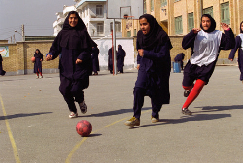 20aliens: IRAN. Tehran. 1998. Girls play football in their school courtyard.A. Abbas