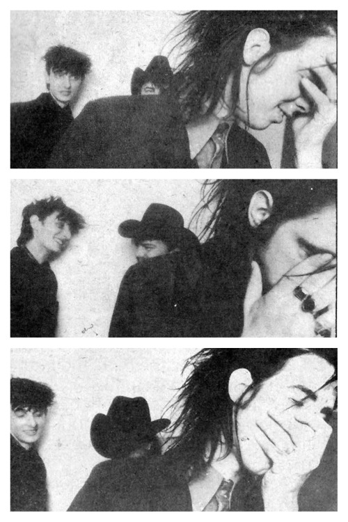 gorgonetta:  [Three b/w photos of Nick Cave suffering in the foreground while Rowland and Tracy laug