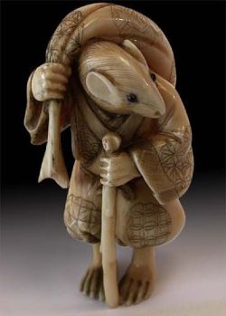 petermorwood:treasures-and-beauty: 19th Century Japanese Carved Ivory Mouse Traveler Netsuke Signed Gyokuseki   There’s quite a “Usagi Yojimbo” vibe off this… :-&gt;