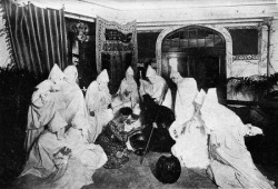 cemeteryjohn: A group of people dressed as ghosts attend a fortune telling/seance party. From The Book of Halloween, 1919. 