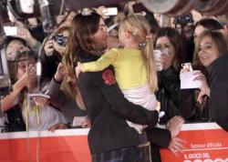 smacksmash:  US actor Jared Leto poses for photographs with a little girl as he arrives for the premiere of ‘Dallas Buyers Club’ at the 8th annual Rome Film Festival 