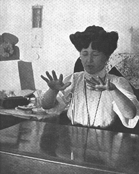 deathandmysticism:Spiritualist medium Stanisława Tomczyk levitating a pair of scissors, Poland, 1909