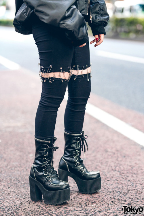 17-year-old Japanese high school student Beni on the street in Harajuku wearing a black bomber jacke