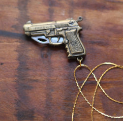 wickedclothes:  Gun Pocketknife Necklace Crafted out of brass, this pistol pendant unfolds to reveal a small, hidden pocketknife blade. Measures 3” in length when unfolded, and 2” when folded. Hung on a 24” gold-plated chain. Sold on Etsy.