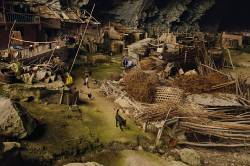 sixpenceee:  In a giant cave in China, there live 21 families. This cave now contains a basketball court and even a school. National Geographic has a great article about this place with many more pictures and video here. 
