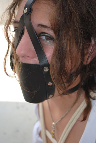 ilikeballgaggedgirls:You can’t see the ball from this muzzle ballgag harness, but she has definitely a ball in her mouth.