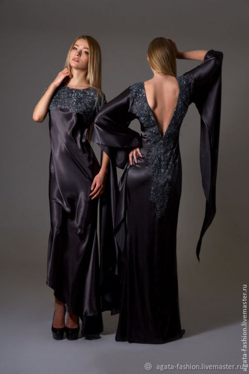 Little black dress - but not so little - in satin with appliquéstunning sleeve detail and low V back