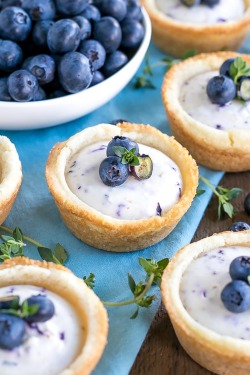 sweetoothgirl:  BLUEBERRY CHEESECAKE COOKIE CUPS  