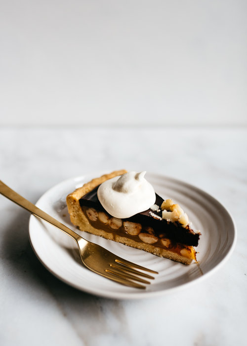 sweetoothgirl:    CHOCOLATE-CARAMEL MACADAMIA NUT TART    Uh&hellip;YES PLEASE!