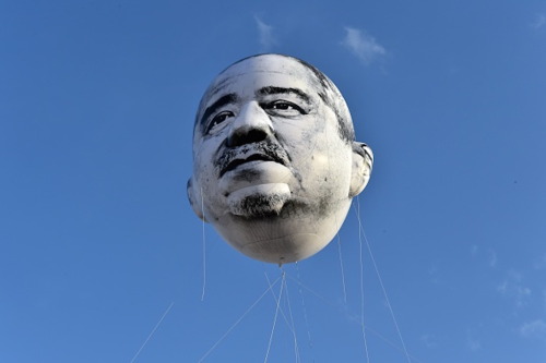 shihlun: A giant helium balloon bearing the face of an ojisan (middle-aged man) appeared in the sky 