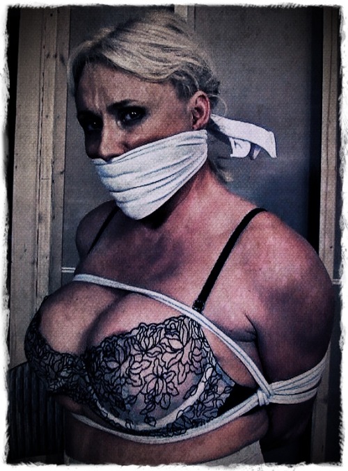 sensualhumiliation:  gaggedfts:  Wonderful photo! Love her emotion & defiant eyes, highlighted by that tight white scarf gag :)  exposed… 