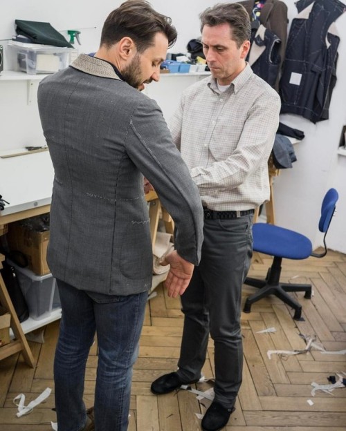 Discussing construction details with my head master tailor during fitting in our workshop. #zarembab