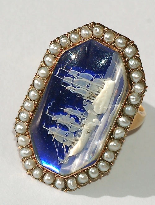 thegentlemanscloset:Men’s ring dating 1798-1800. High carat gold, seed pearls, and cobalt blue glass