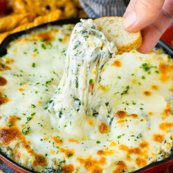 foodffs:This spinach artichoke dip is a mix of freshly cooked spinach, artichoke hearts and three types of cheese, all baked to golden brown perfection. A classic party snack that always gets rave reviews from family and friends.Follow for recipesIs this