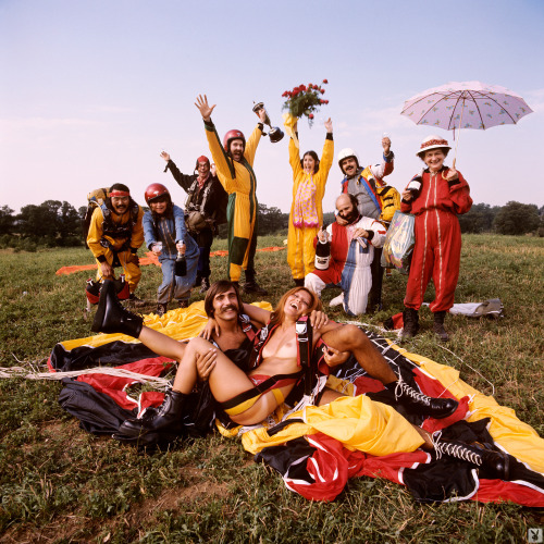 Lieko English poses in the middle of a group of hippie “paracutists” for her 1971 Playbo