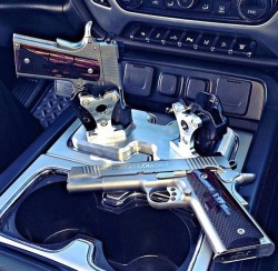 Gunsblades:  Pistol Holder In Car Instead Of Coffee Stand.