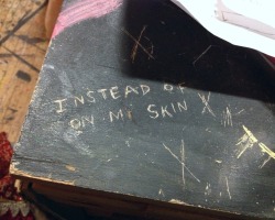 posssibly:  Someone carved this into a table