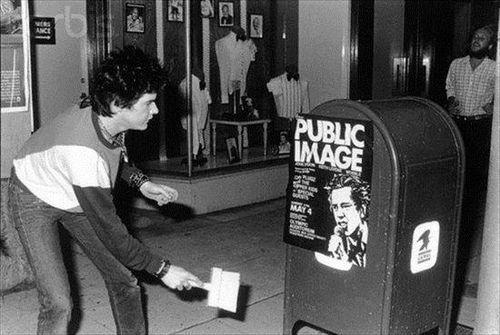 Darby Crash Posting Up A Public Image Flyer 