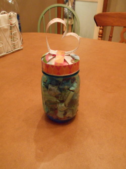 housewifesecrets:  thehardcorelifeguard:  The gift I gave my little sister for her high school graduation. A mason jar filled with folded paper stars and money. The thought is anytime she is having a bad day or just need a pick-me-up she takes a star