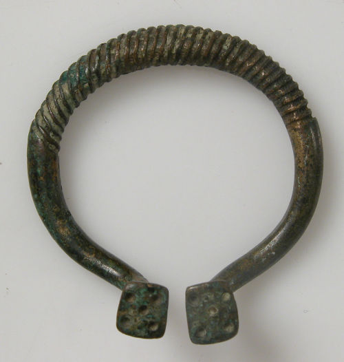 Bronze ring from a penannular brooch (Anglo-Saxon, 800s).  Itsdimensions are 4.7 x 4.5 x 1.6 cm.