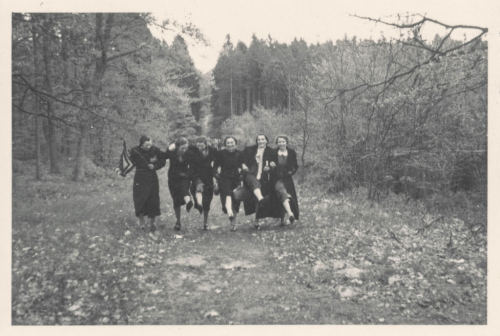 simple-insomnia:Group of women dancing down a forest path