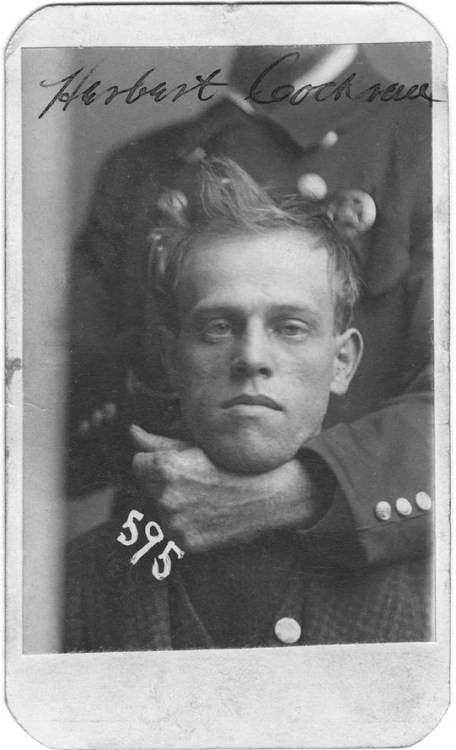 An unidentified member of the Omaha police force holds Herbert Cockran in a headlock during his mug shot. Cockran was arrested on Nov. 24, 1899, for burglary. Nudes &amp; Noises  